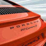 Painted "PORSCHE" logo and model designation in Black (high-gloss)